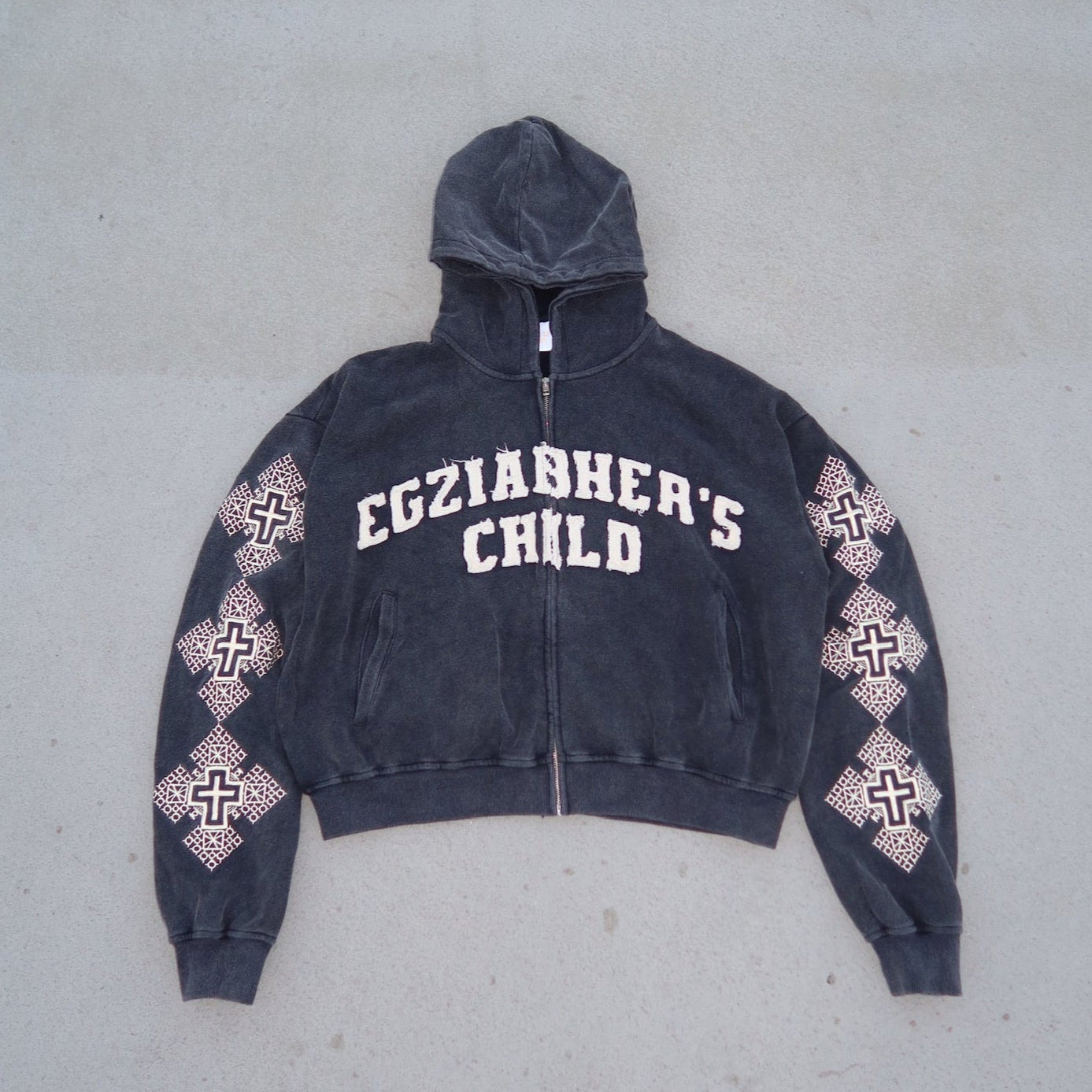 Dark gray hoodie with 'EGZIABHER'S CHILD' text on a light gray background